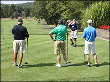 WAI Chapters Men on the golf course at a Chapter golfing event.